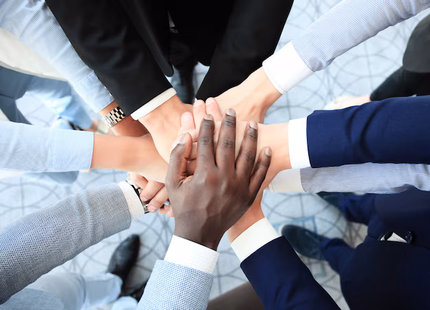 group-business-people-joining-hands_484651-5721